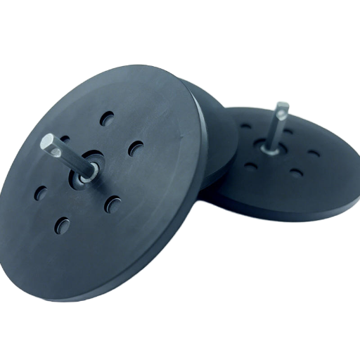 Rubber-to-metal bonded inserts and brackets co-vulcanized into one part